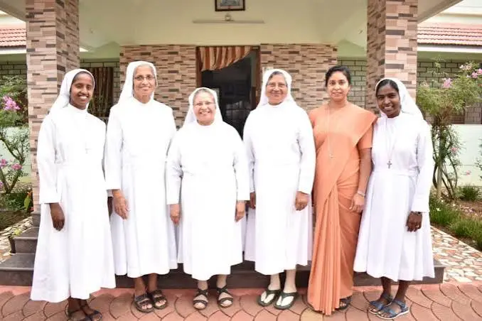 Auxilium School Maradiyur management team — Salesian sisters and dedicated educators standing together at the school campus