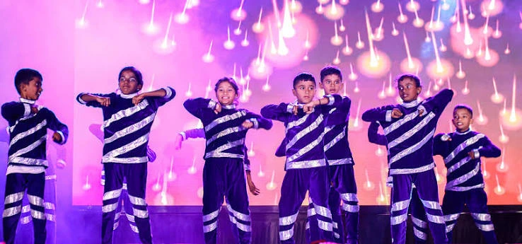Students performing a cultural dance at Auxilium School Maradiyur annual day celebrations