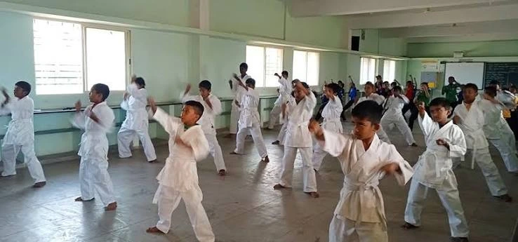 Students training in karate and martial arts at Auxilium School Maradiyur